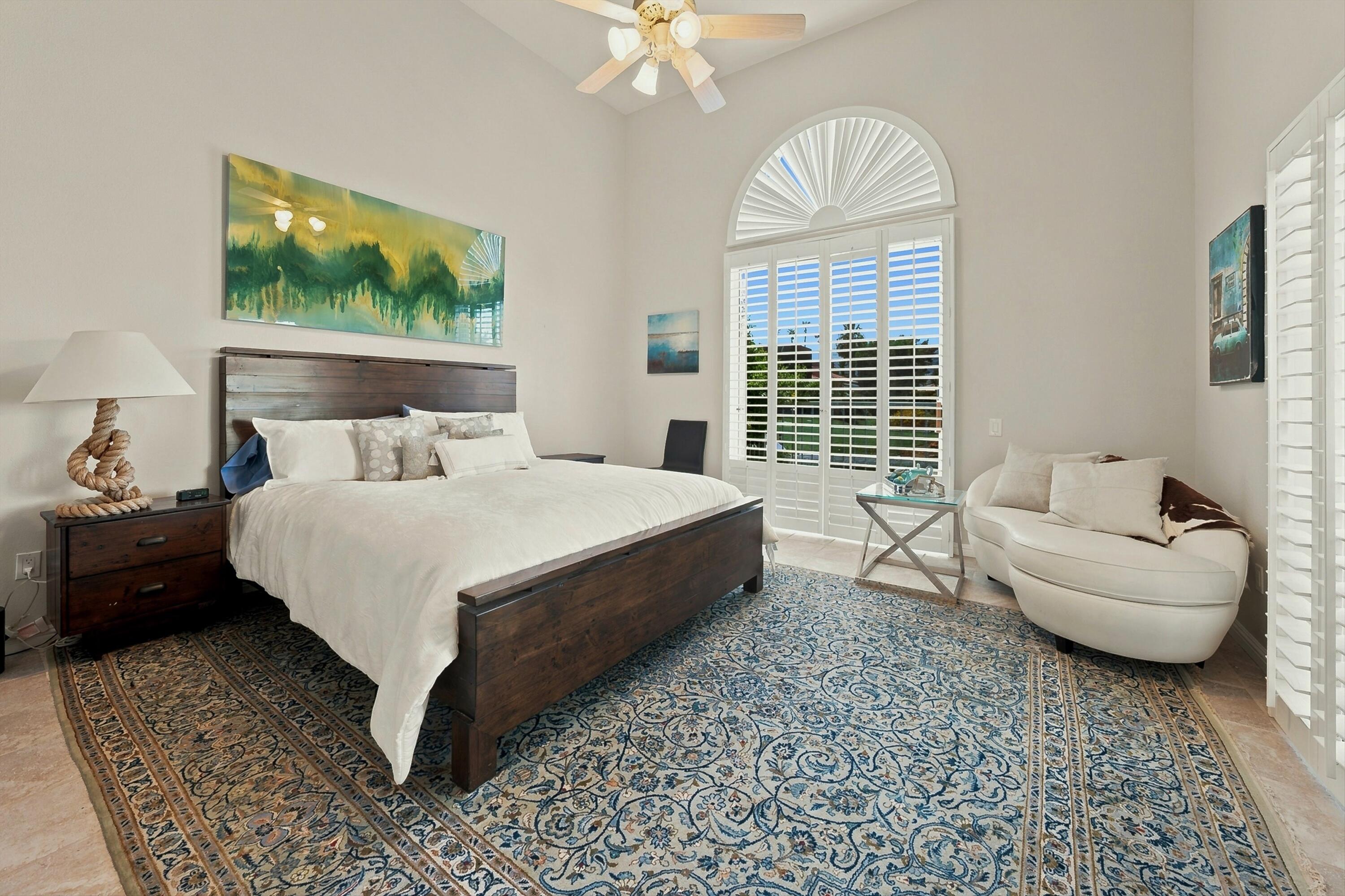 138 Lakeshore Drive Rancho Mirage, CA 92270 - Photo 15 of 30 a bed room with a bed and a large window
