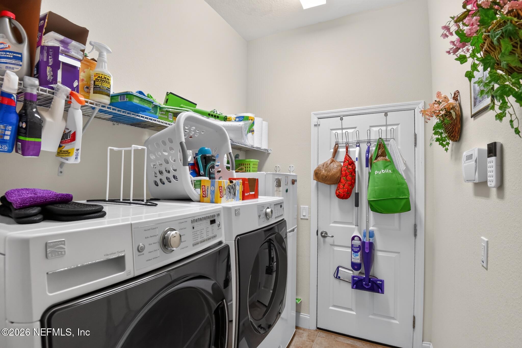 110 Vía Roma Ormond Beach, FL 32174 - Photo 32 of 43 a utility room with dryer and washer