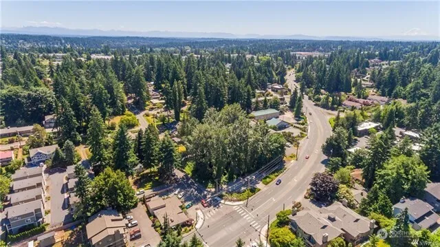 an aerial view of multiple house with yard