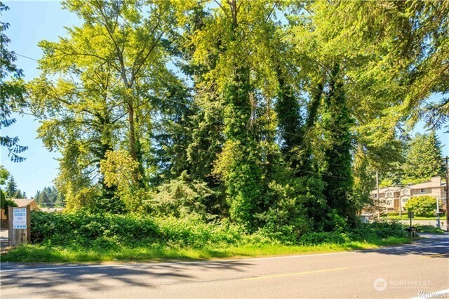 23601 Edmonds Way Edmonds, WA 98026 - Photo 8 of 17 a view of a yard with plants and trees beside of it