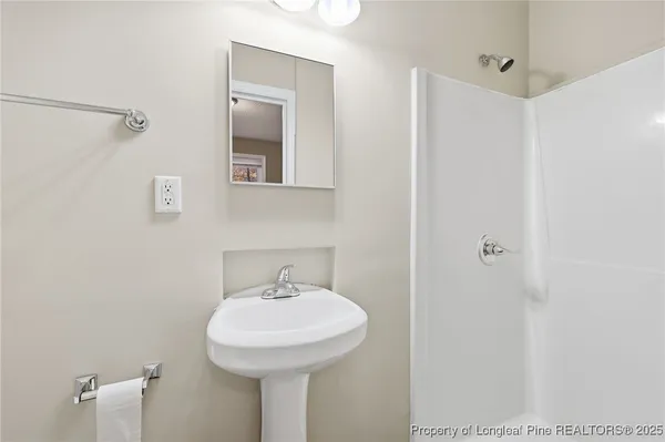 a bathroom with a sink and mirror