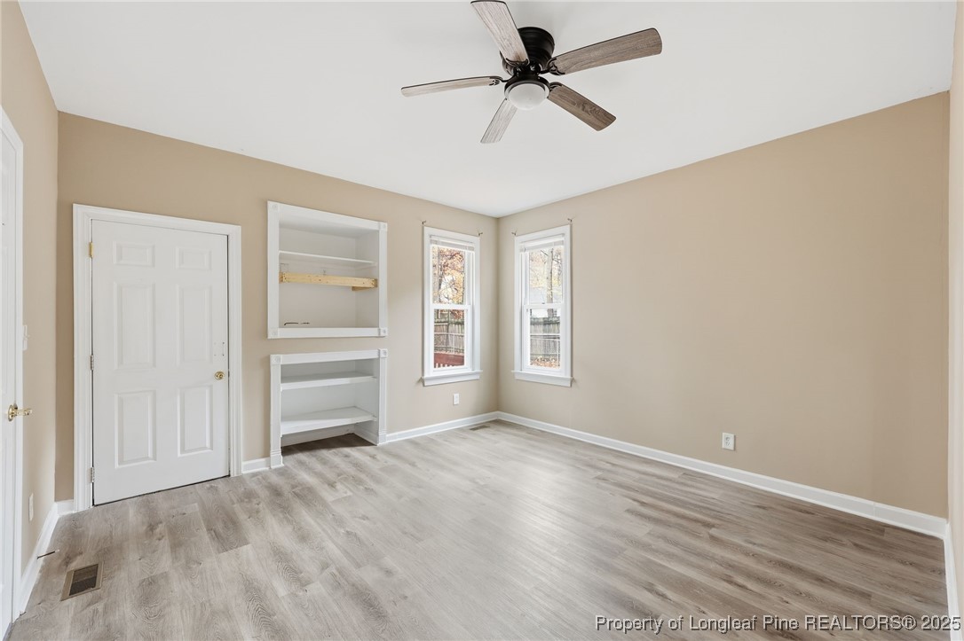3204 Hickory Road Raleigh, NC 27616 - Photo 16 of 49 a view of empty room with wooden floor and fan