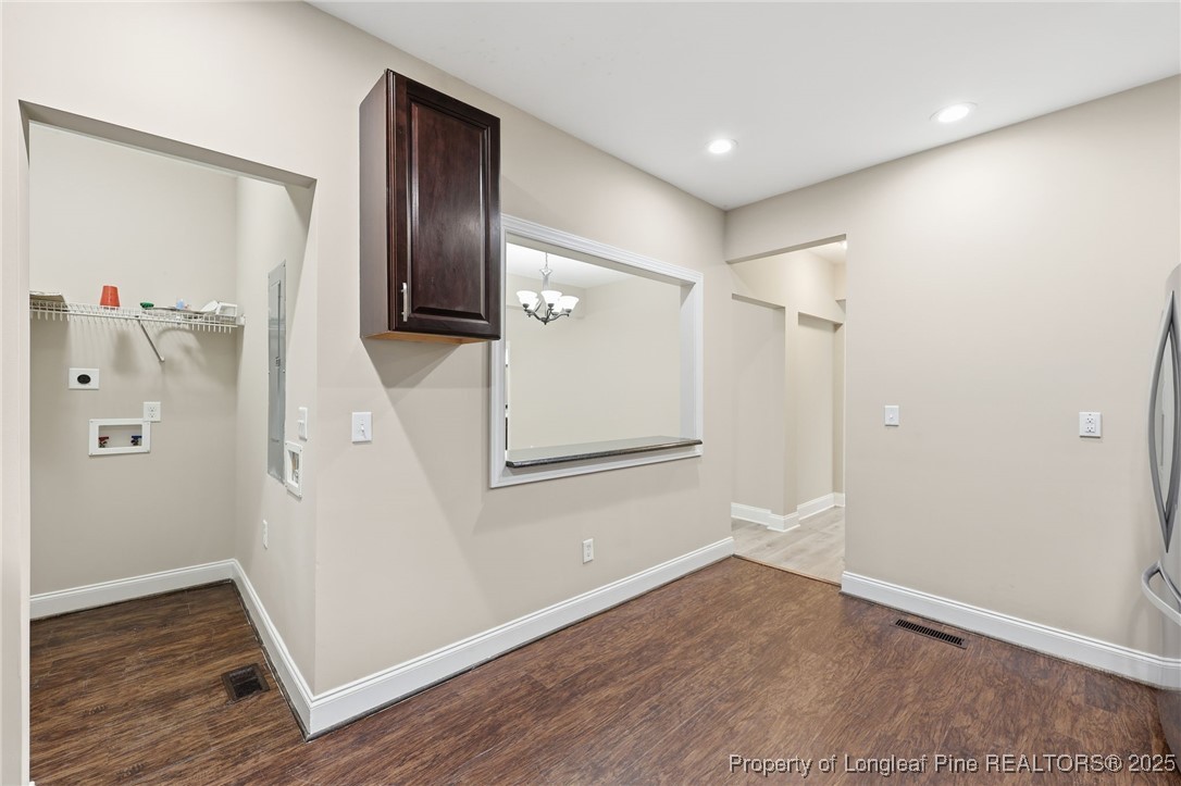 3204 Hickory Road Raleigh, NC 27616 - Photo 22 of 49 an empty room with wooden floor and entryway