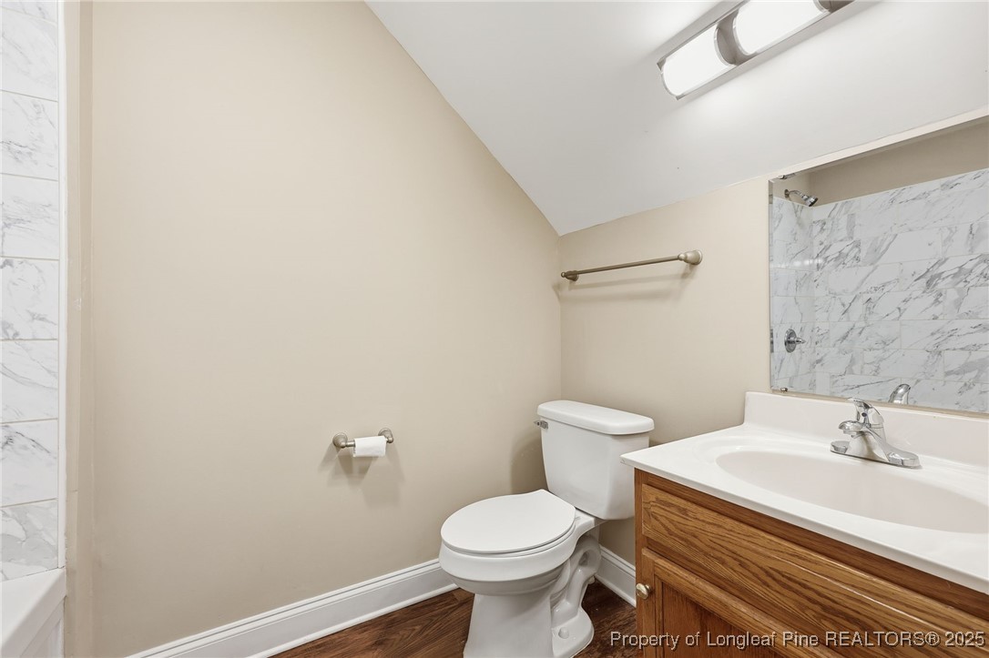 3204 Hickory Road Raleigh, NC 27616 - Photo 26 of 49 a bathroom with a sink a toilet and a mirror