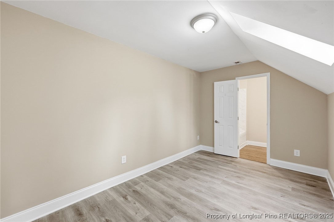3204 Hickory Road Raleigh, NC 27616 - Photo 29 of 49 a view of an empty room with wooden floor