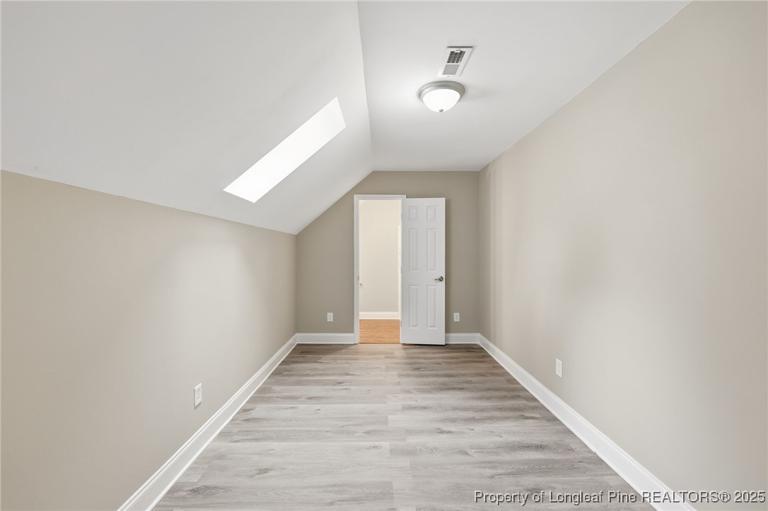 3204 Hickory Road Raleigh, NC 27616 - Photo 32 of 49 a view of an empty room with wooden floor