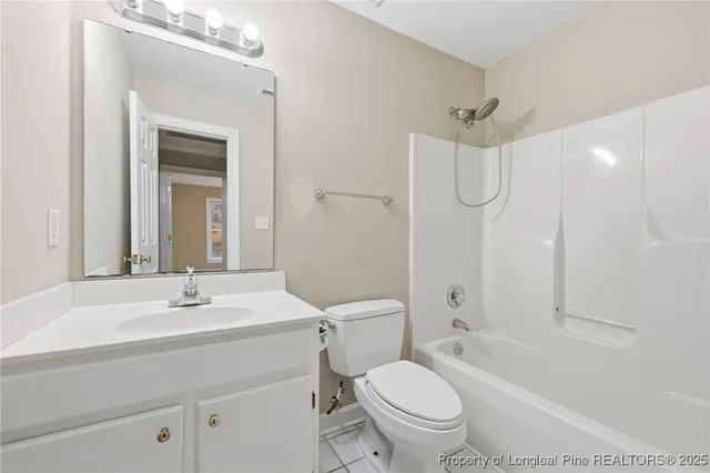 a bathroom with a sink toilet tub and shower