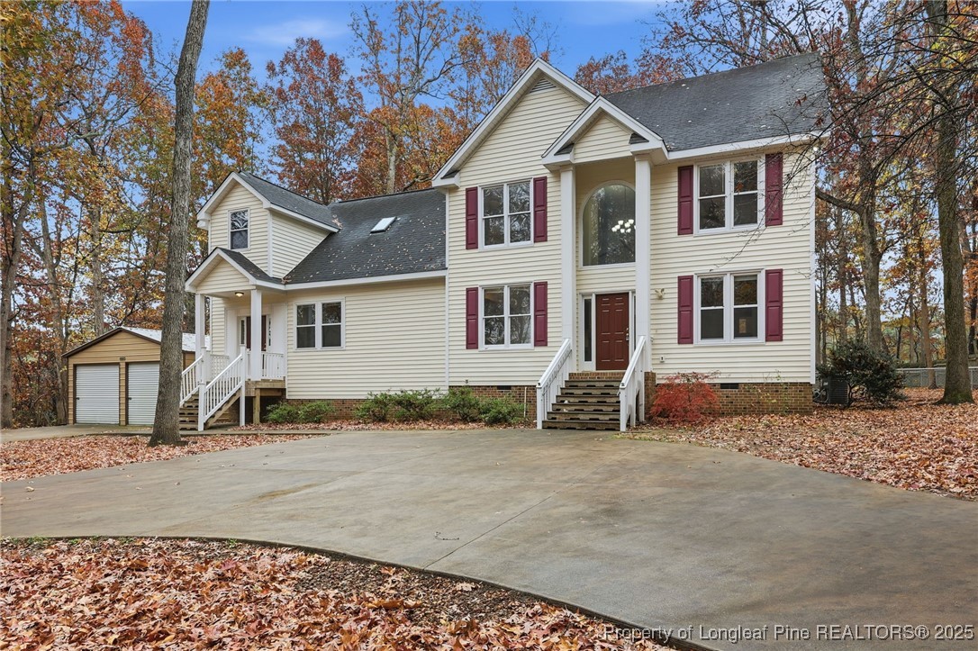 3204 Hickory Road Raleigh, NC 27616 - Photo 5 of 49 a view of a white house with large windows next to a road