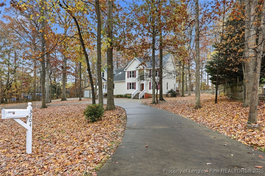 3204 Hickory Road Raleigh, NC 27616 - Photo 7 of 49 a view of road with trees