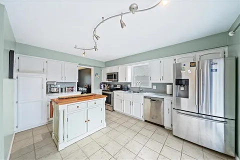 $445,000 | 10219 Caenen Drive, Lenexa, KS 66215