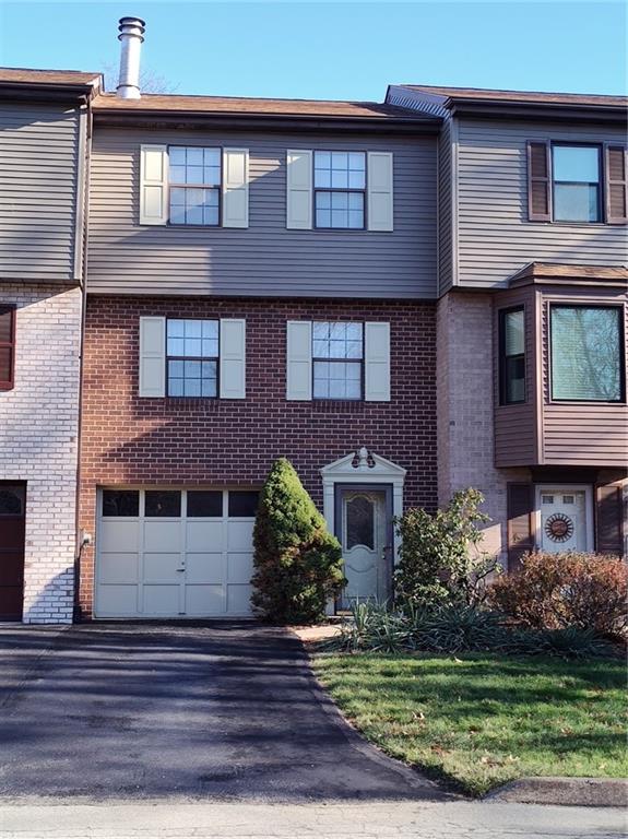 7448 Lighthouse Point Pittsburgh, PA 15221 - Photo 1 of 36 a front view of a house with garden