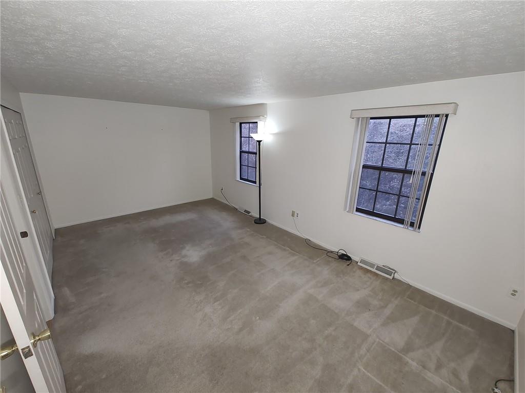 7448 Lighthouse Point Pittsburgh, PA 15221 - Photo 18 of 36 an empty room with windows