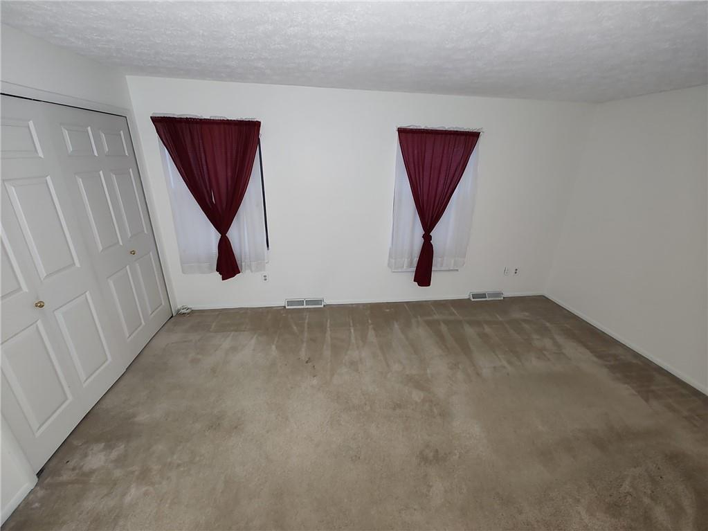 7448 Lighthouse Point Pittsburgh, PA 15221 - Photo 23 of 36 an entryway room with wooden floor and windows
