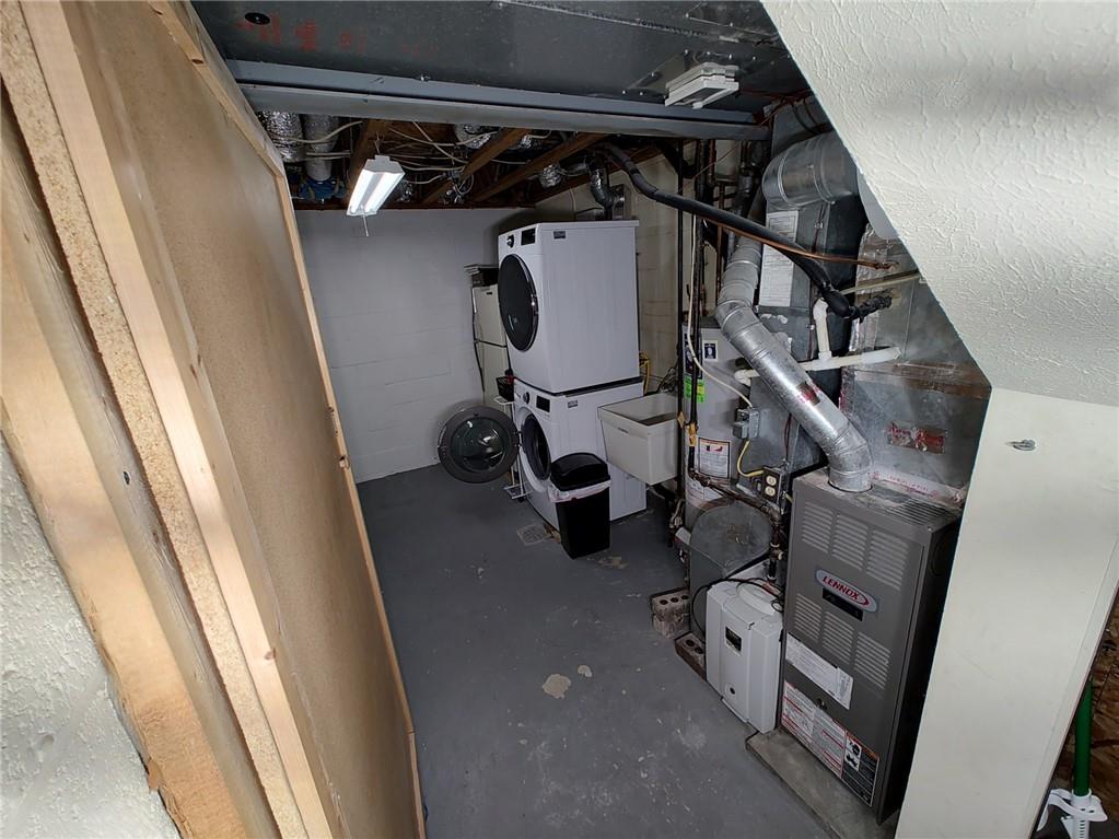 7448 Lighthouse Point Pittsburgh, PA 15221 - Photo 32 of 36 a view of walk in closet with clothes and shoes