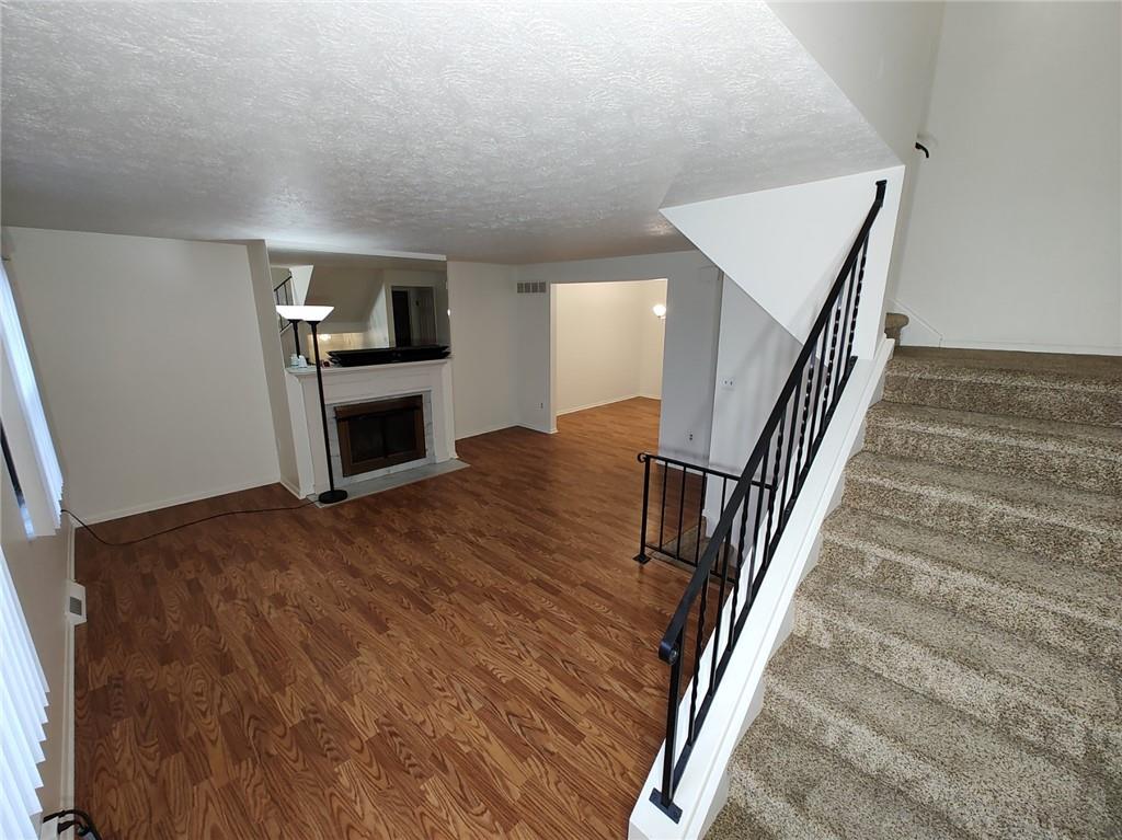7448 Lighthouse Point Pittsburgh, PA 15221 - Photo 5 of 36 a view of a livingroom with kitchen and an empty room