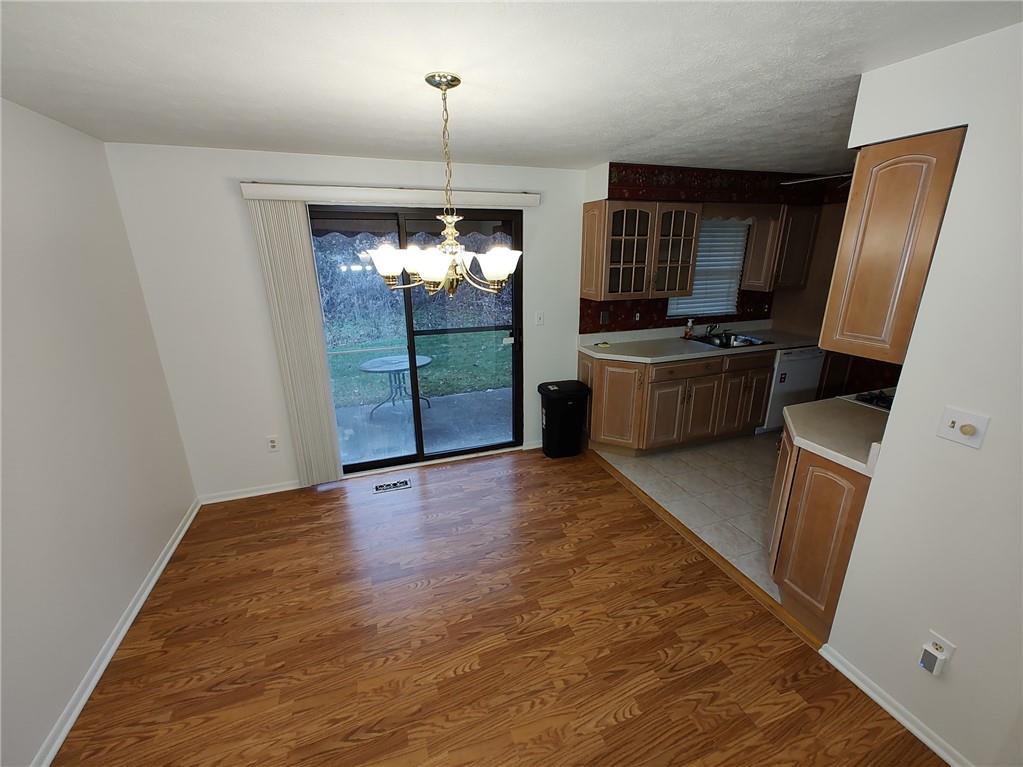 7448 Lighthouse Point Pittsburgh, PA 15221 - Photo 9 of 36 a view of kitchen with sink microwave and refrigerator