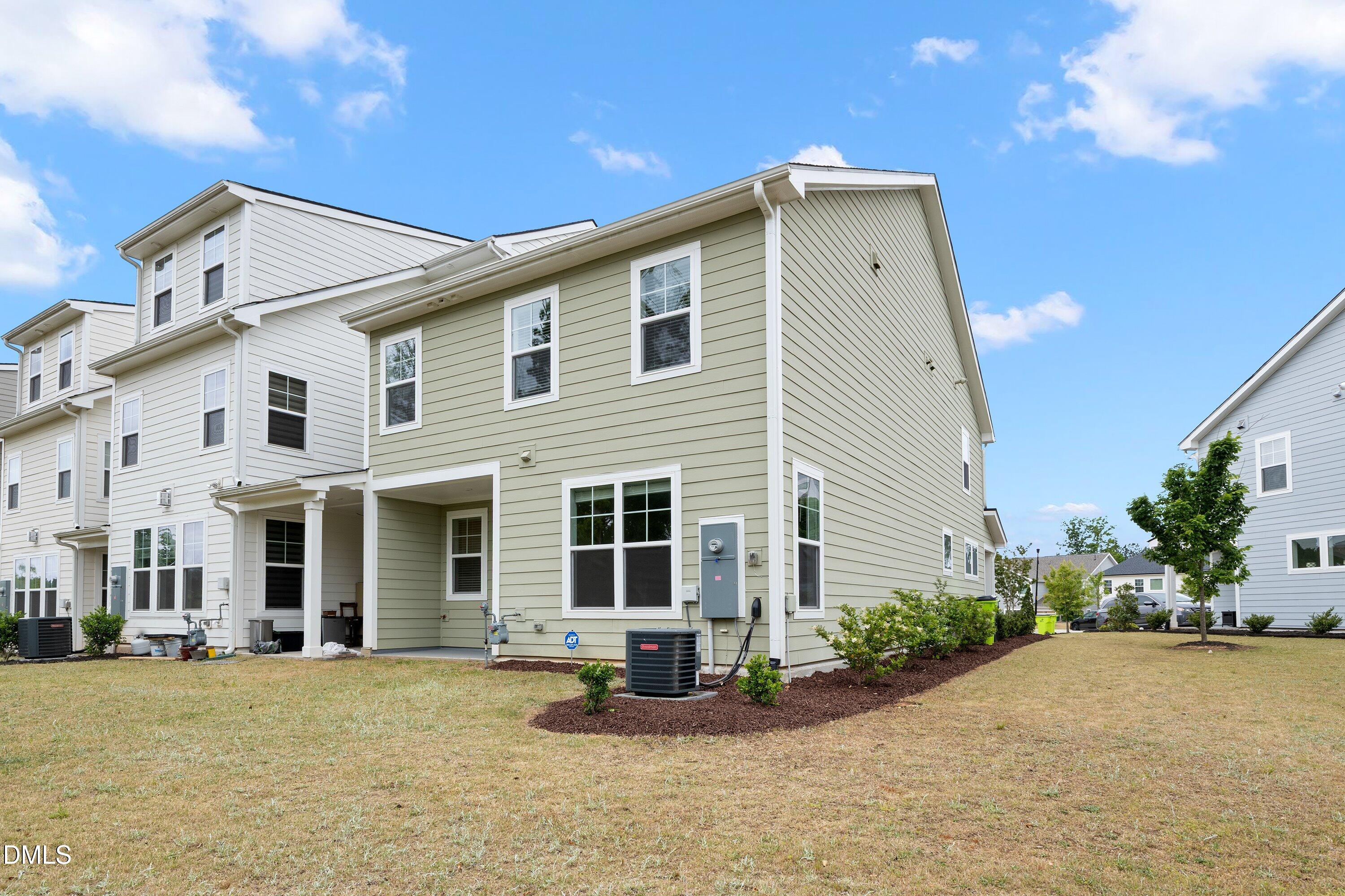 156 Sears Ridge Lane Morrisville, NC 27560 - Photo 41 of 49 a front view of a house with a garden