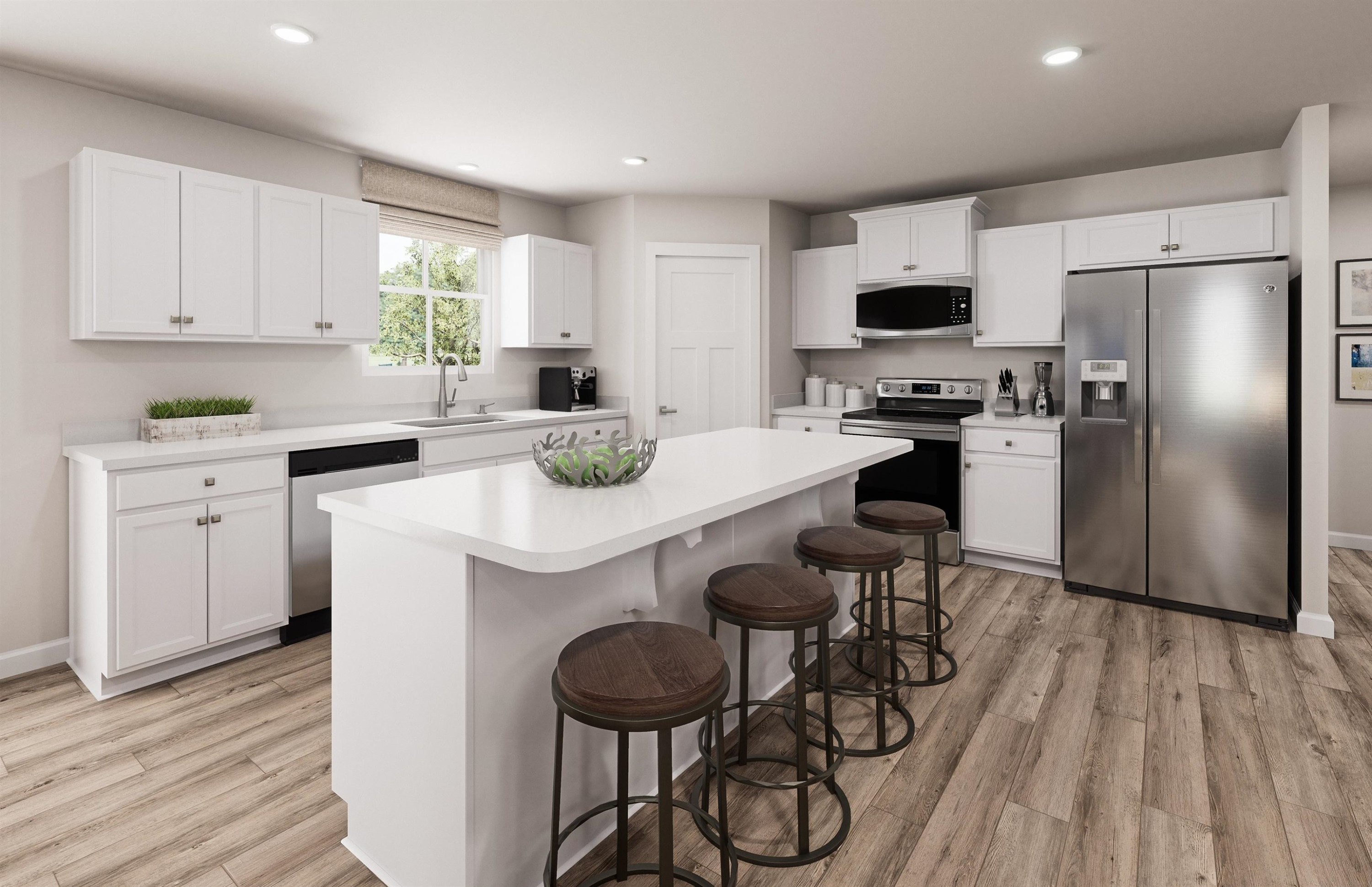 8564 Kenridge Lane Fuquay-Varina, NC 27526 - Photo 4 of 16 a kitchen with a sink a stove a refrigerator and white cabinets with wooden floor