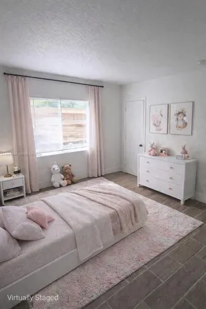 a bedroom with a bed and a cabinets