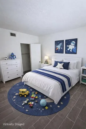 a bedroom with a bed and a cabinets