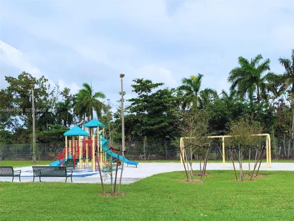 a view of a park with a slide