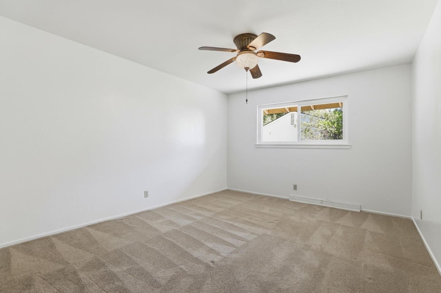 208 Mill Creek Road Fremont, CA 94539 - Photo 20 of 59 an empty room with windows and fan