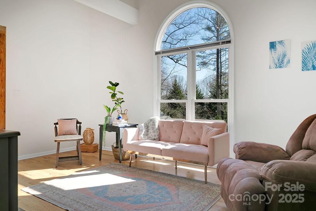 1881 Becky Mountain Road Brevard, NC 28712 - Photo 9 of 40 a living room with furniture and a window