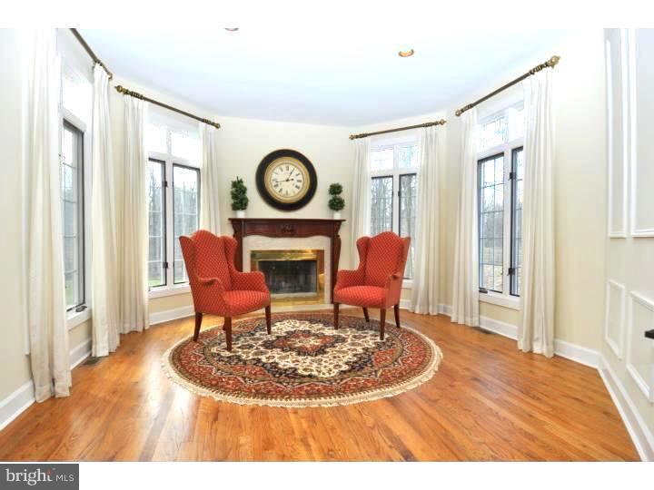 202 South Radnor Chester Road Villanova, PA 19085 - Photo 8 of 25 a living room with furniture a clock on wall and a window