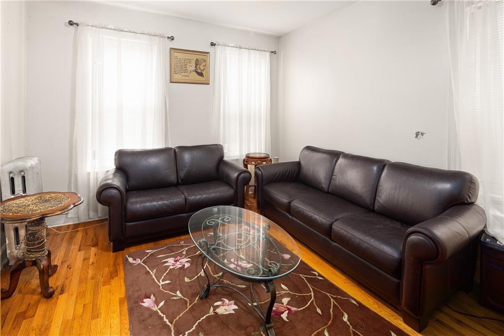 1088 Lenox Road Brooklyn, NY 11212 - Photo 8 of 9 a living room with furniture and a window
