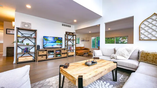 a bedroom with two beds and a tv