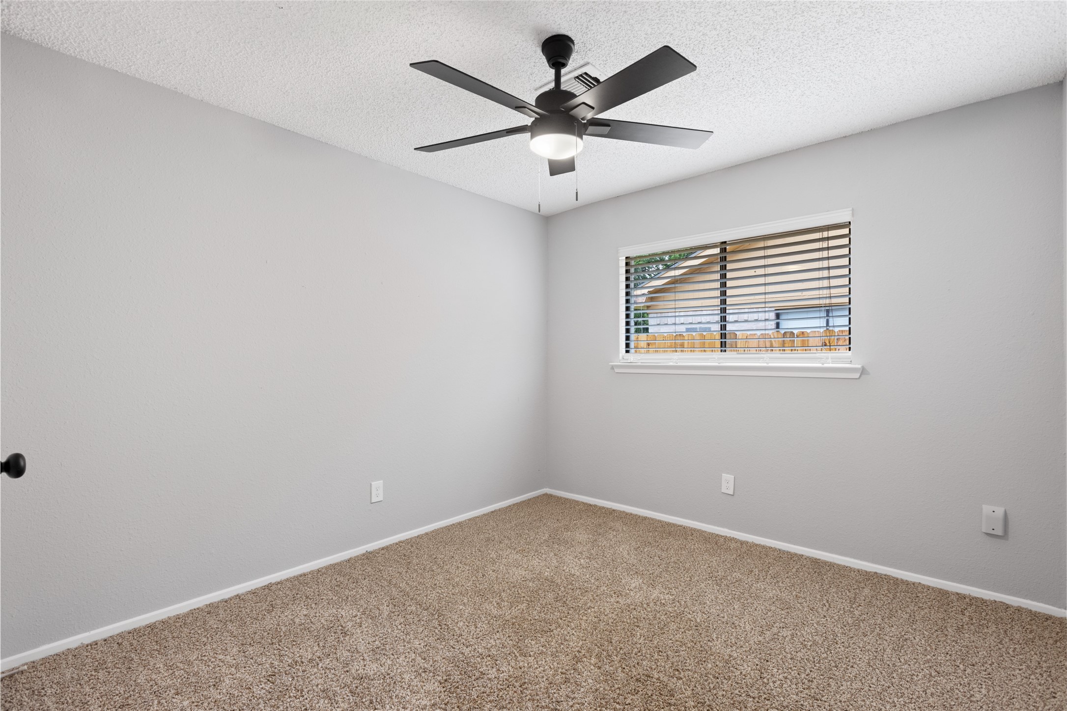 2314 Peaceful Valley Drive Spring, TX 77373 - Photo 13 of 20 an empty room with a window and a ceiling fan
