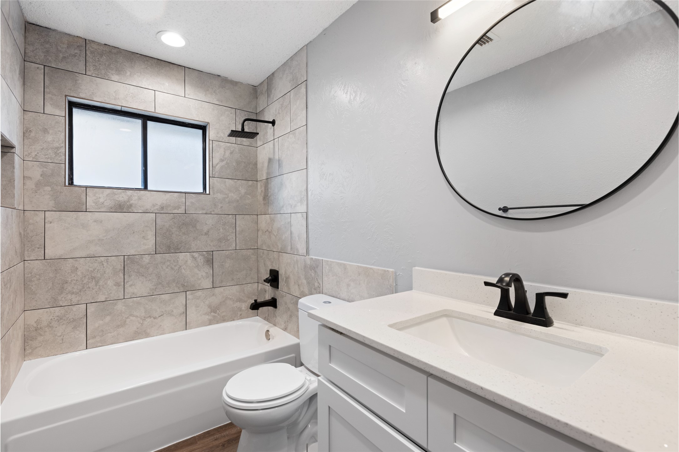 2314 Peaceful Valley Drive Spring, TX 77373 - Photo 14 of 20 a bathroom with a sink a toilet and a mirror