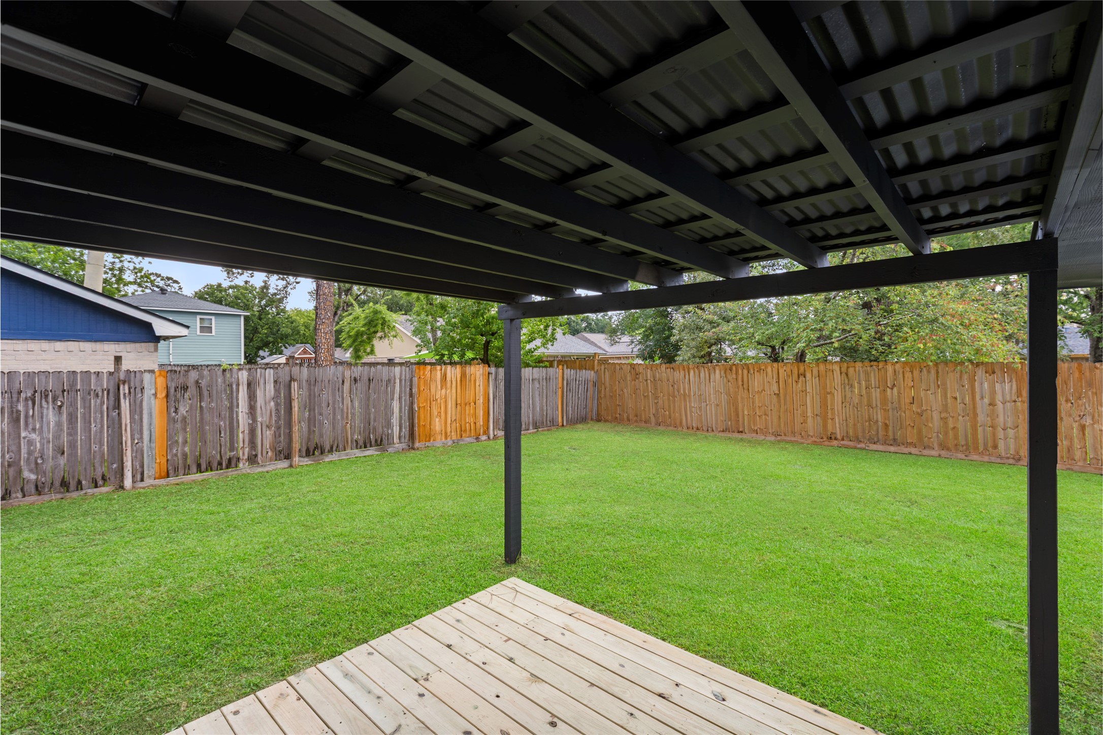 2314 Peaceful Valley Drive Spring, TX 77373 - Photo 17 of 20 a backyard of a house with lots of green space