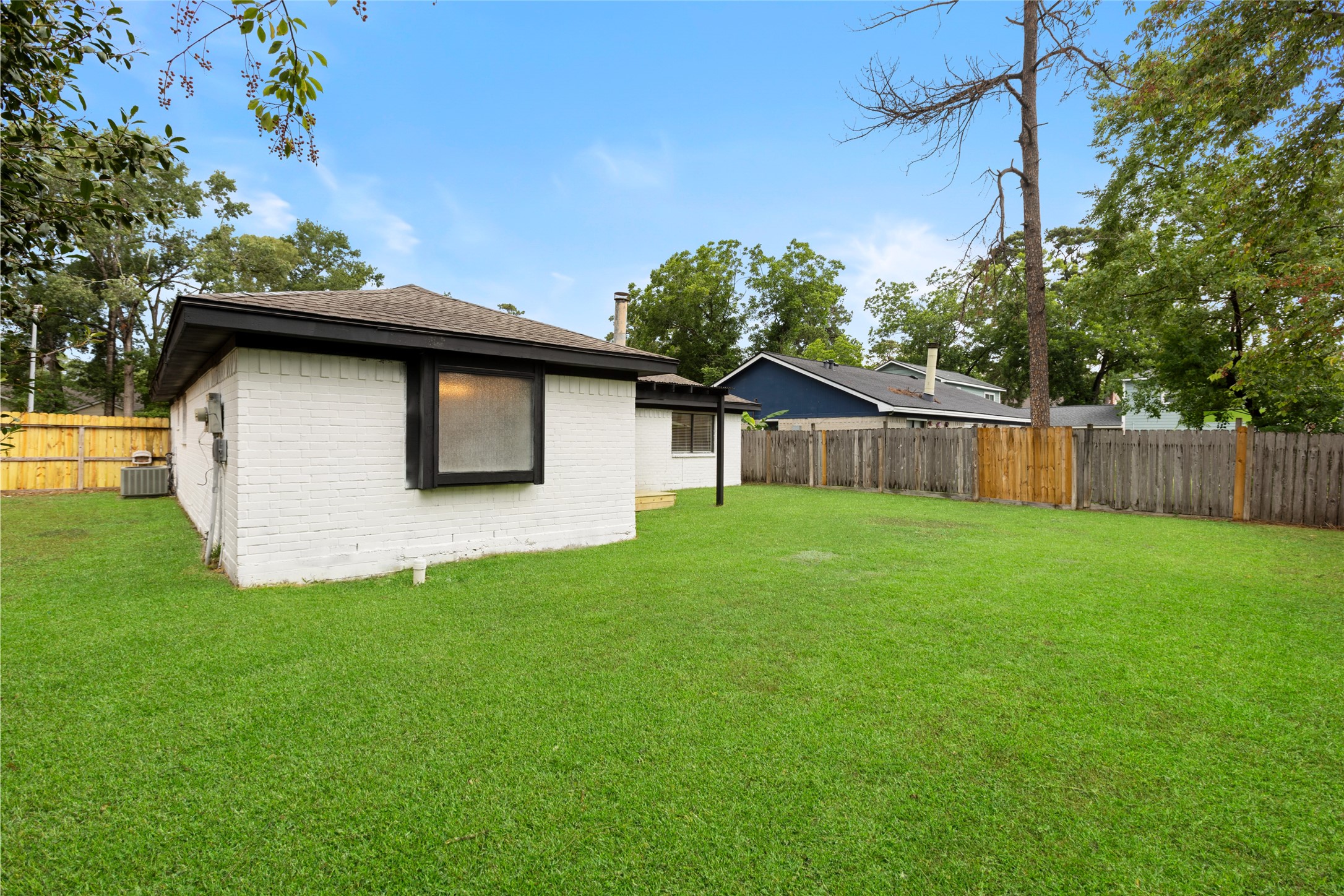 2314 Peaceful Valley Drive Spring, TX 77373 - Photo 20 of 20 a view of a backyard with a large tree