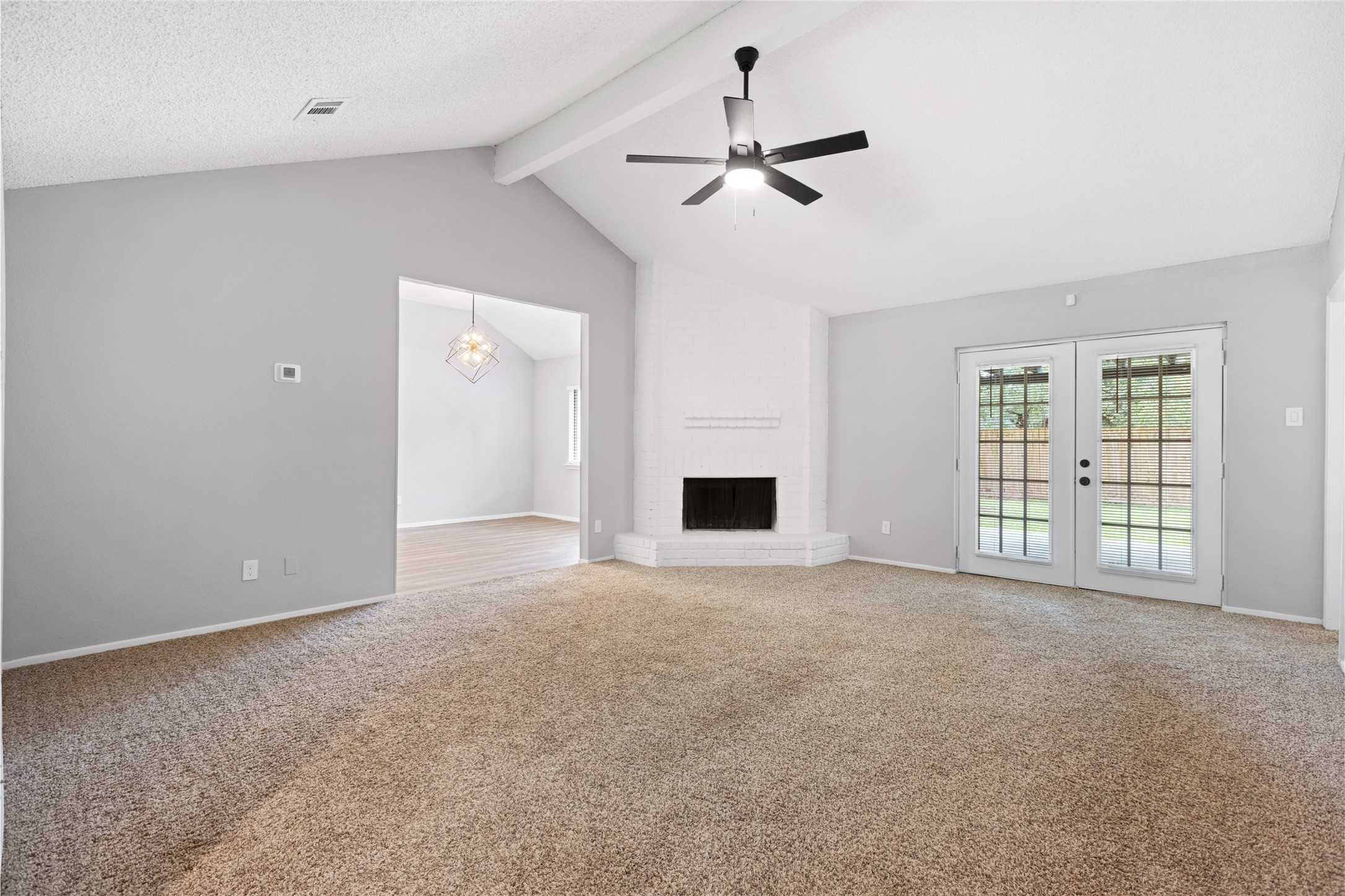 2314 Peaceful Valley Drive Spring, TX 77373 - Photo 5 of 20 a view of an empty room with chandelier and a window