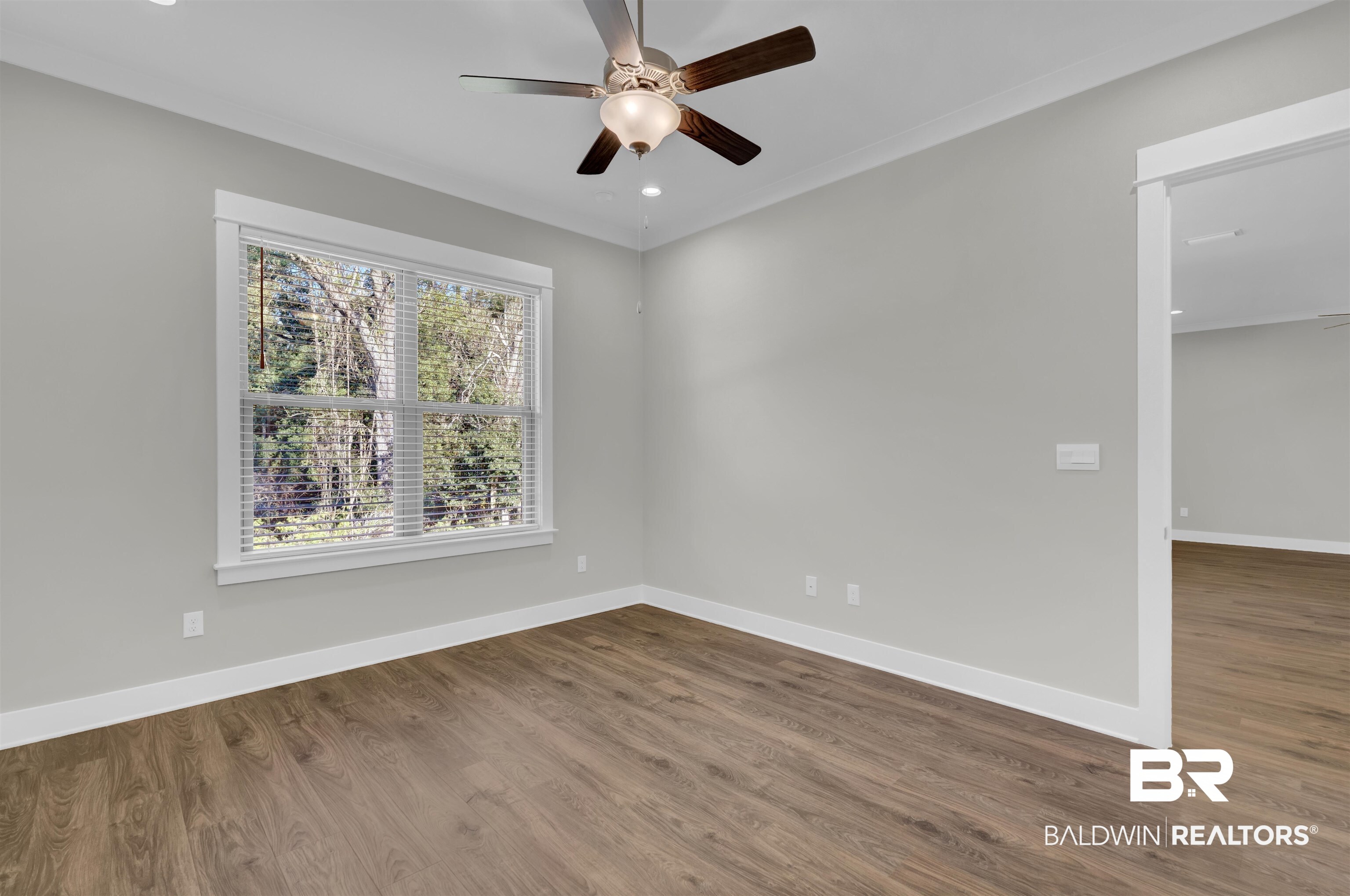 571 Morning Mist Way Fairhope, AL 36532 - Photo 18 of 47 Empty room featuring dark wood-type flooring, ceiling fan, recessed lighting, and ornamental molding