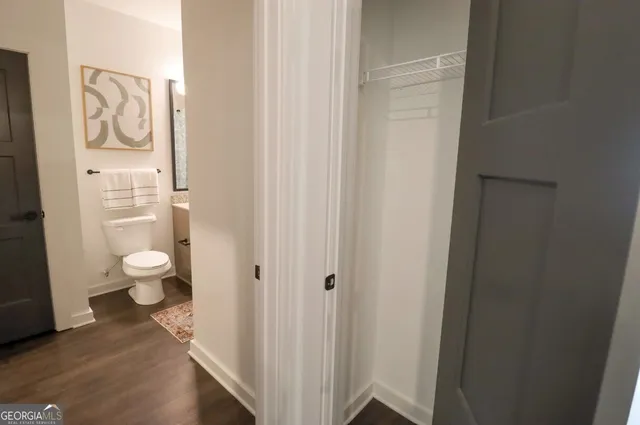 a picture of a kitchen and an empty room