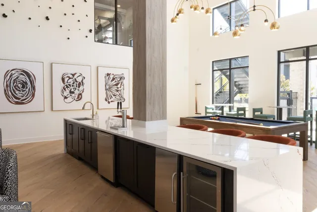 a view of a dinning table and chairs in the balcony