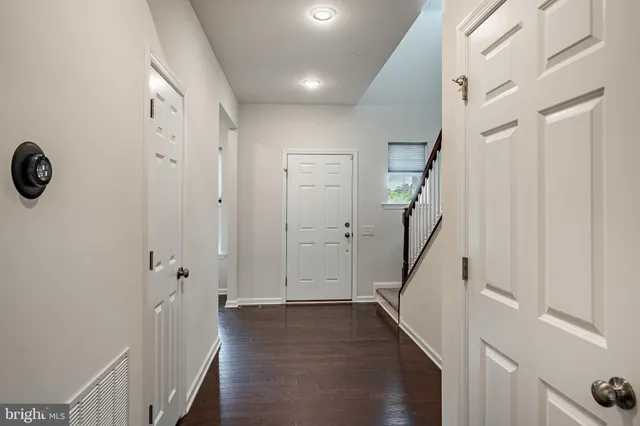 a view of an entryway with wooden floor