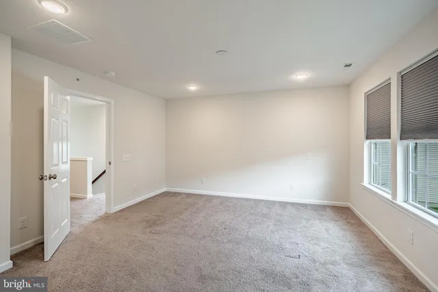 a bathroom with a granite countertop sink a mirror and a shower
