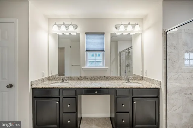 a bathroom with a toilet and shower