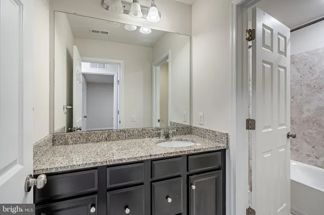 a bathroom with a bath tub