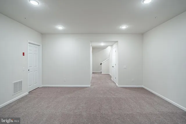a view of a hallway with staircase