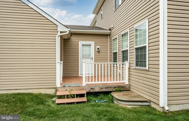 a view of porch with wooden floor