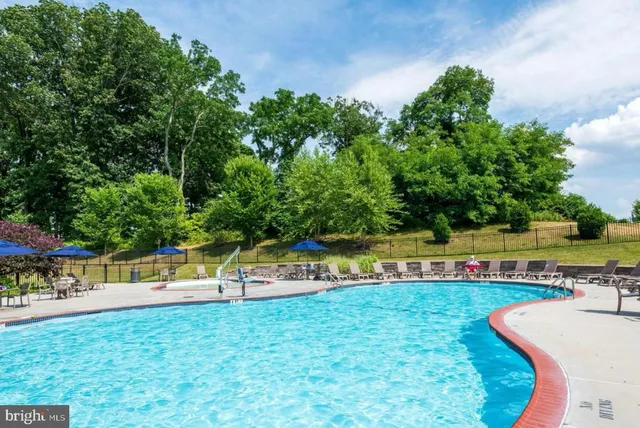 an aerial view of a house swimming pool and outdoor space