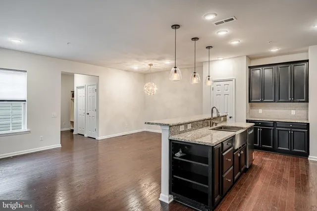 a kitchen with a stove and a sink