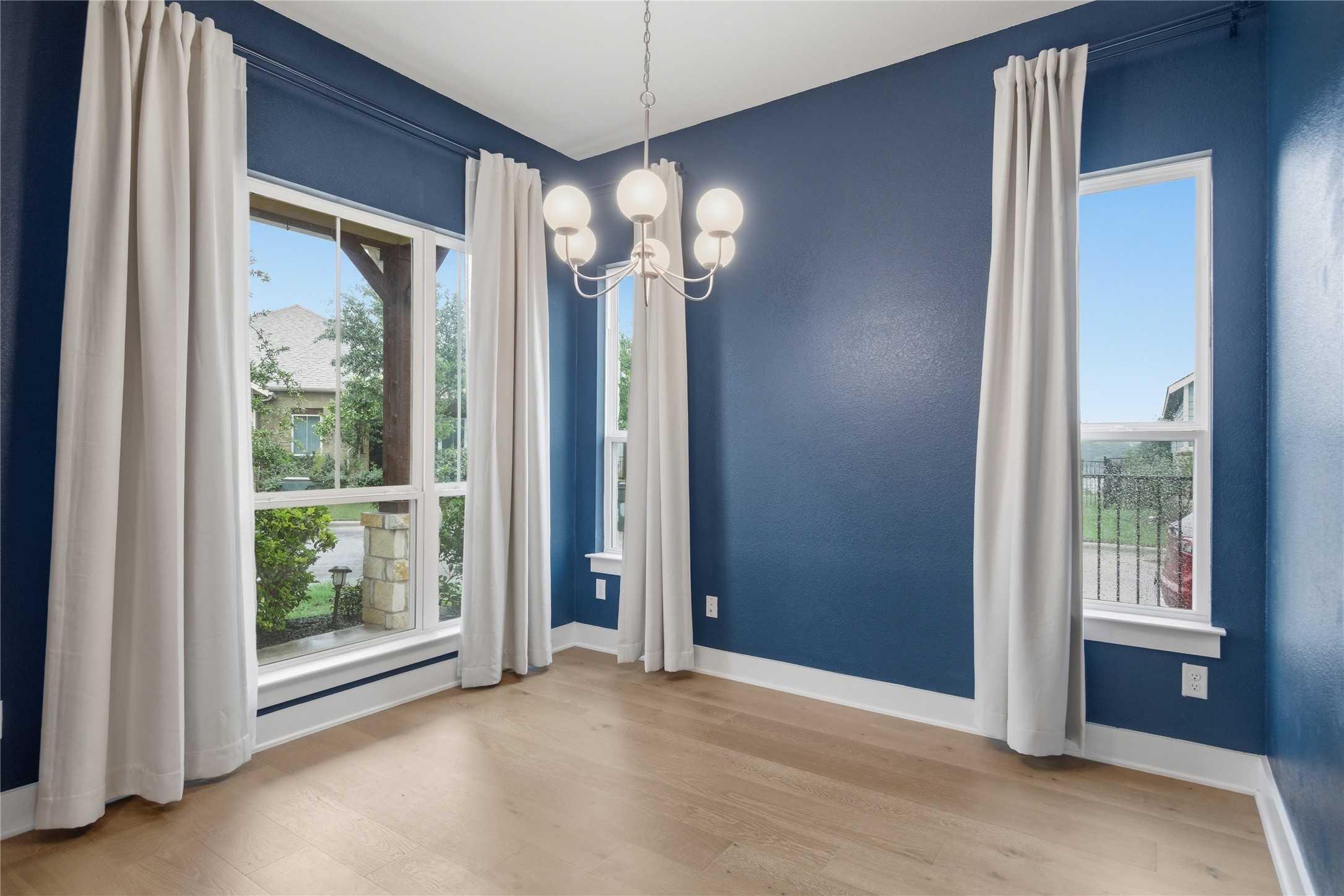 1300 Harwell Loop Kyle, TX 78640 - Photo 8 of 21 a view of a room with a large window and chandelier
