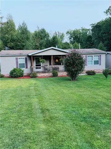 a view of a backyard of the house