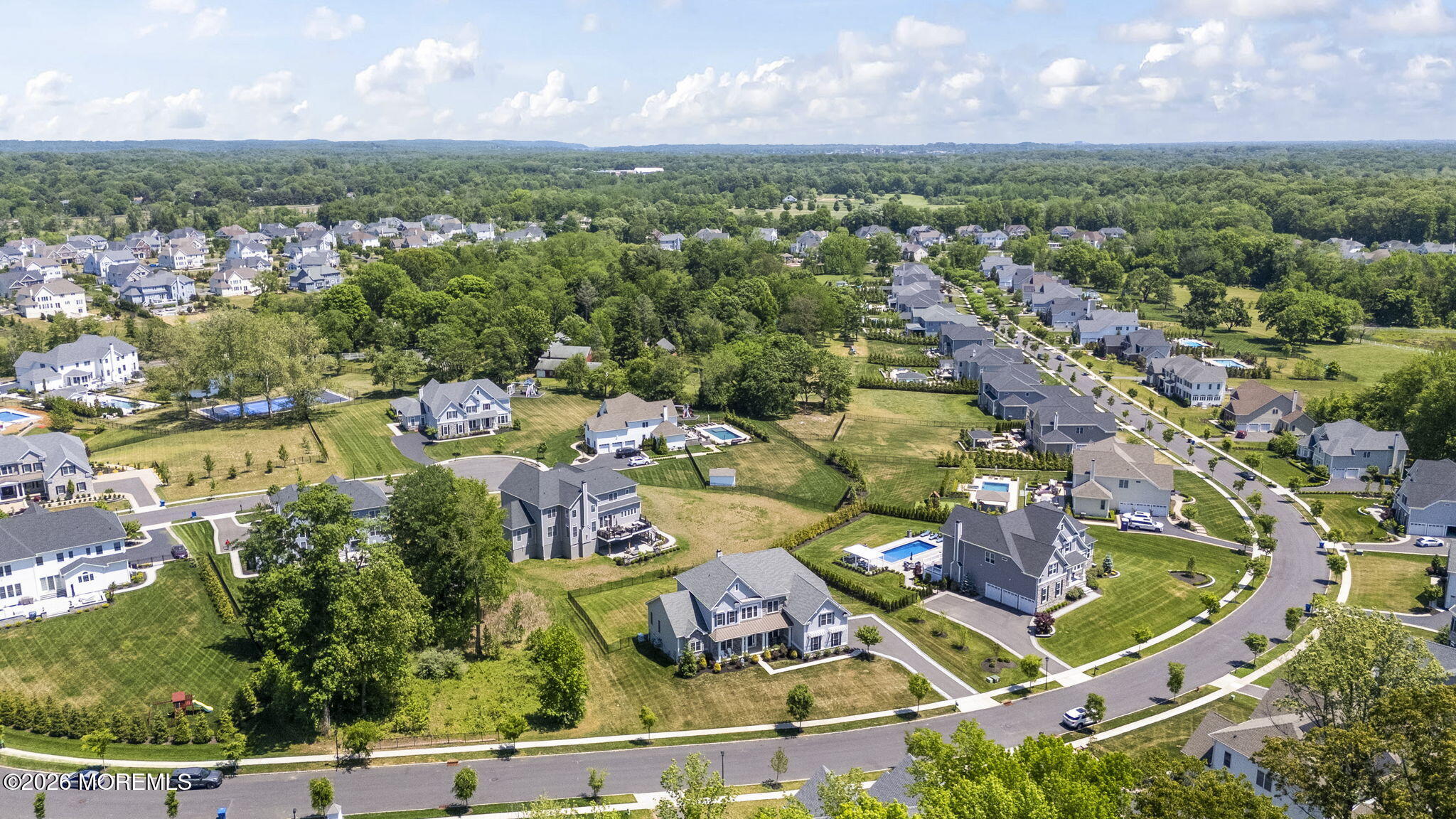 66 Windermere Road Lincroft, NJ 07738 - Photo 40 of 48 an aerial view of residential houses with outdoor space and swimming pool