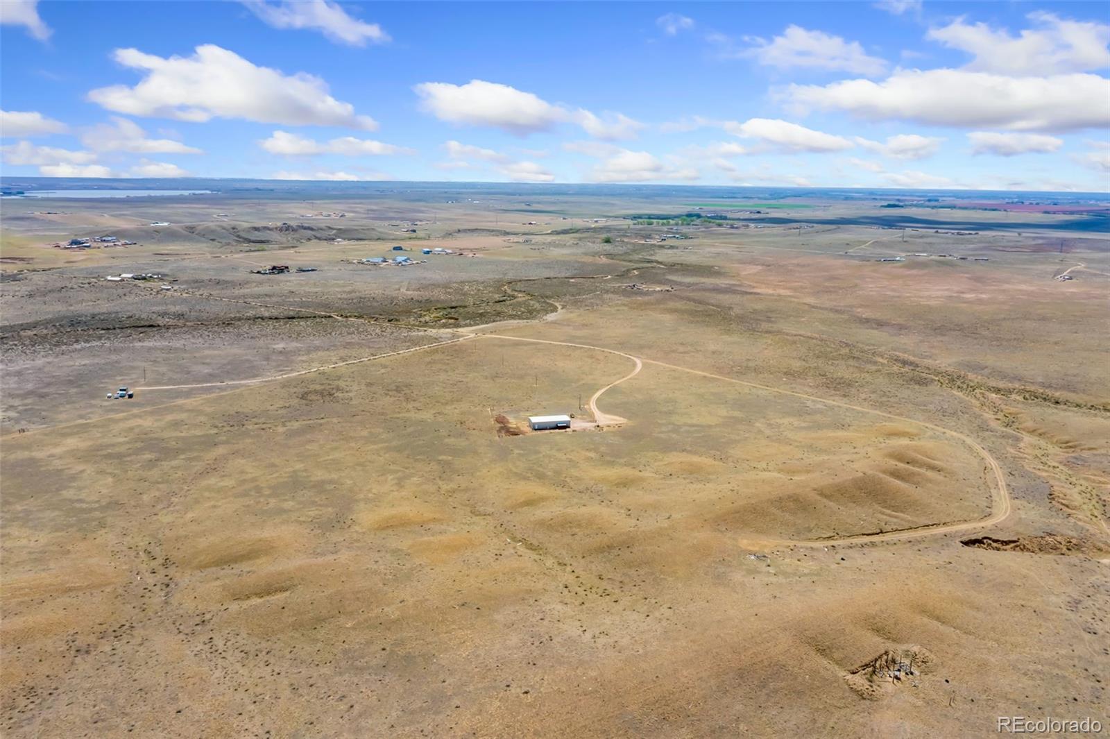 20179 Rawhide Flats Road Wellington, CO 80549 - Photo 11 of 12 a view of an ocean beach